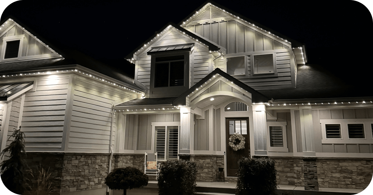 White accent lighting on a two-story home