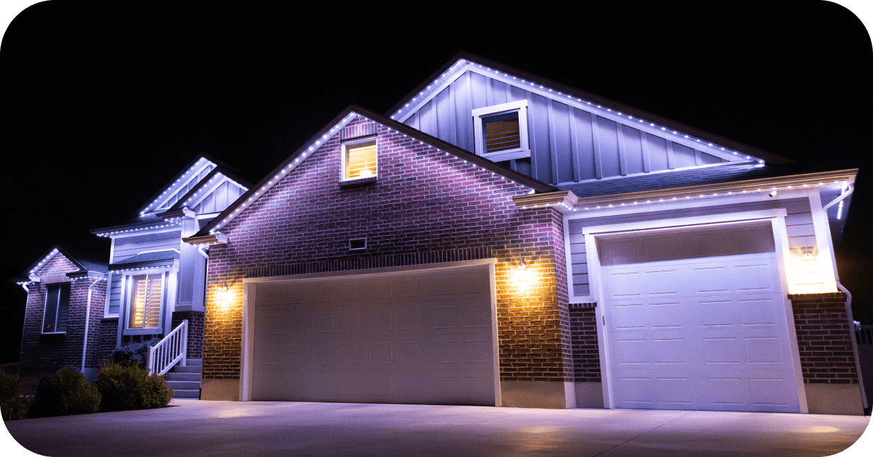 Bright lighting above a driveway and garage
